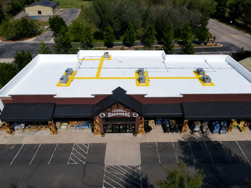 Completed Durango, Colorado hardware store roof restored with a bright white Conklin reflective coating